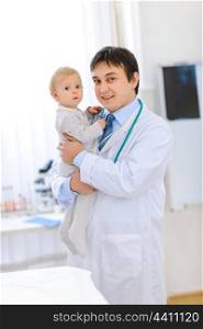 Portrait of happy cute baby on hands of pediatrician&#xA;
