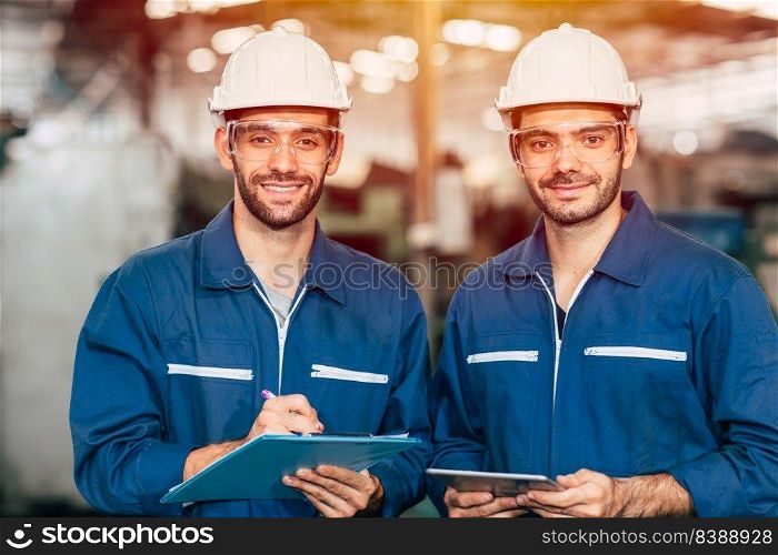 Portrait of happy engineer teamwork smiling looking at camera.