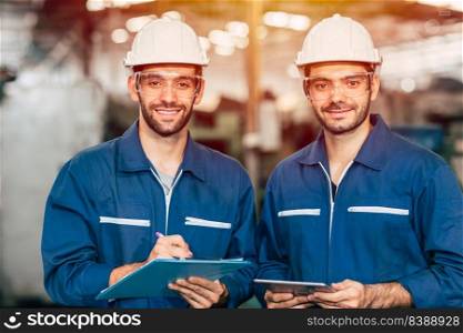 Portrait of happy engineer teamwork smiling looking at camera.