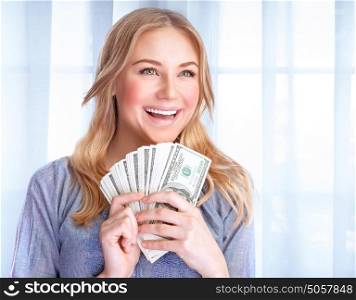 Portrait of happy excited woman holding in hands lot of money, at home, financial success, wealth concept