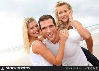 Portrait of happy family at the beach