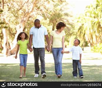 Portrait of Happy Family Walking In Park