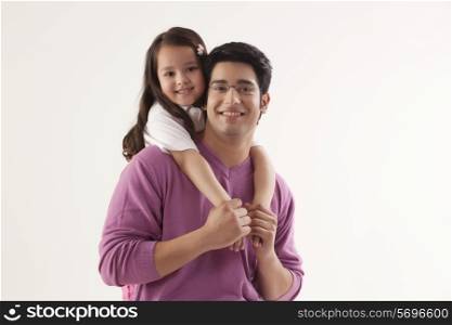 Portrait of happy father and daughter over white background