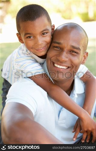 Portrait of Happy Father and Son In Park