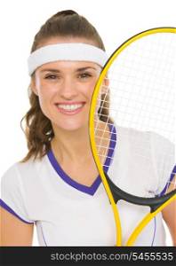 Portrait of happy female tennis player with racket