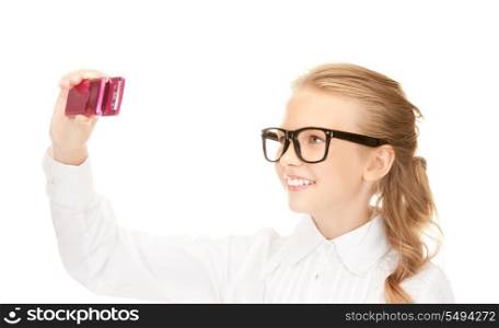 portrait of happy girl taking picture with cell phone