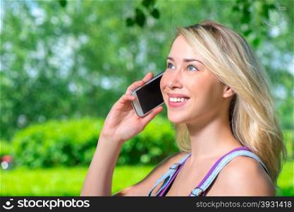 portrait of happy girl with a mobile phone