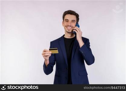 Portrait of happy handsome businessman talking by mobile phone and holding credit card isolated over white background. Technology, payment and online shopping concept.