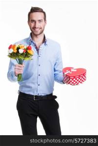 Portrait of happy handsome man with flowers and a gift - isolated on white.