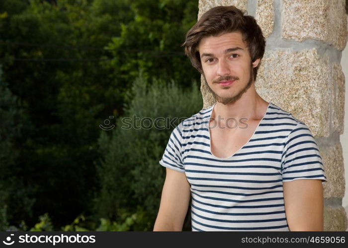 portrait of happy handsome young man, summer outdoors.