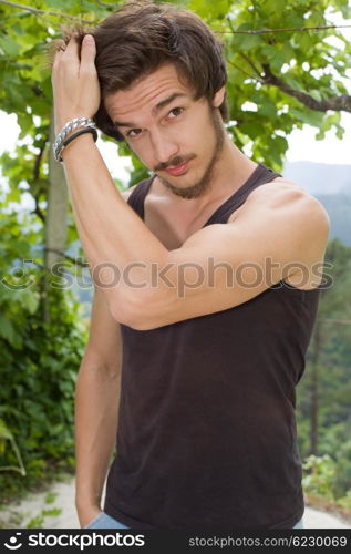 portrait of happy handsome young man, summer outdoors.