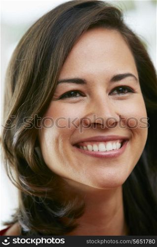 Portrait Of Happy Hispanic Woman At Home