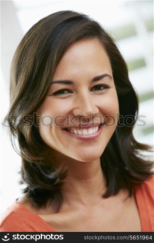 Portrait Of Happy Hispanic Woman At Home