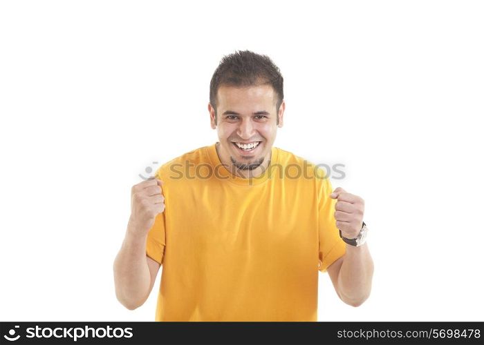 Portrait of happy Indian young man cheering with clenched fists isolated over white background