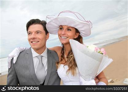 Portrait of happy married couple at the beach