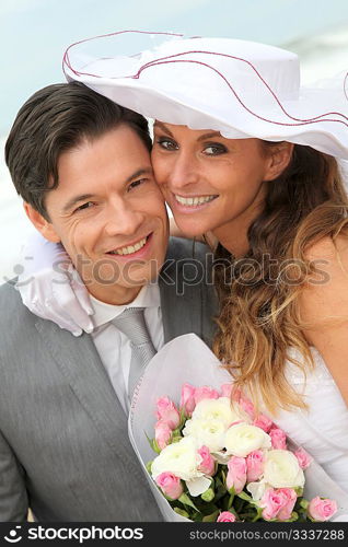 Portrait of happy married couple at the beach