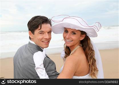 Portrait of happy married couple at the beach