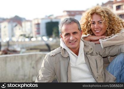 Portrait of happy mature couple in town
