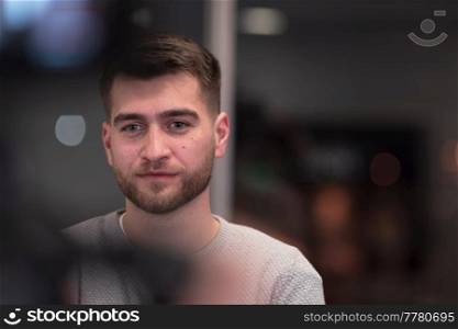 Portrait of happy millennial male business owner in modern office. Businessman, smiling and looking at camera. Leadership concept. Head shot. High-quality photo. Portrait of happy millennial male business owner in modern office. Businessman, smiling and looking at camera. Leadership concept. Head shot.
