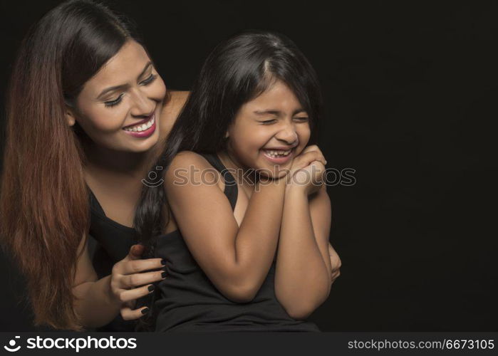 Portrait of happy mother and daughter