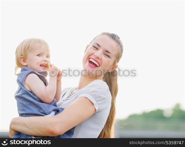 Portrait of happy mother with baby