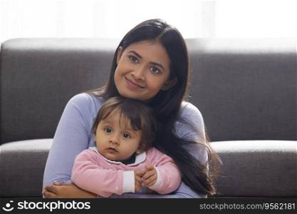 Portrait of happy mother with her cute baby