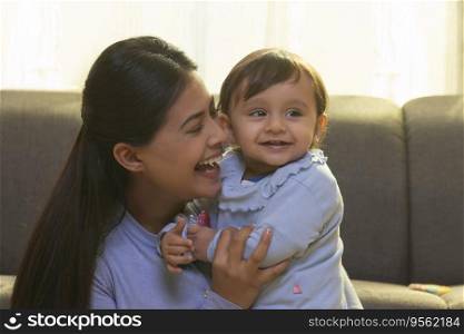 Portrait of happy mother with her cute baby