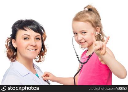 Portrait of happy pediatrician and girls 7 years the patient on a white background