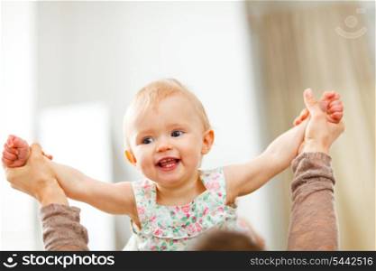 Portrait of happy playing baby at home&#xA;