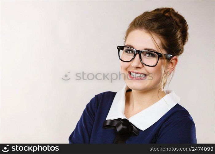 Portrait of happy positive busi≠ss woman wearing eyeglasses, accountant or teacher, enjoying her work.. Happy positive busi≠ss woman, accountant