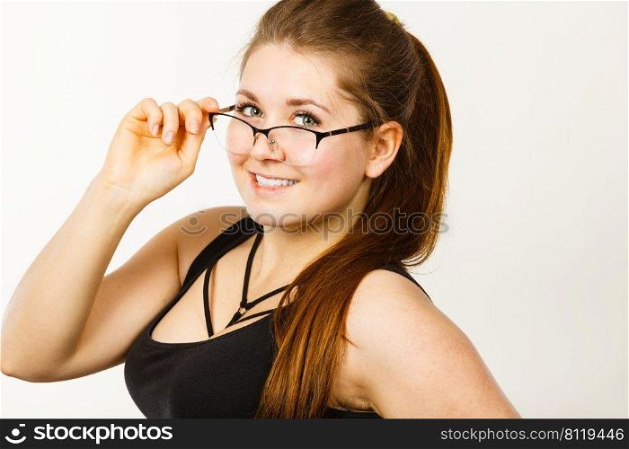 Portrait of happy positive business woman or student girl wearing eyeglasses, enjoying her work, college.. Happy positive business woman or student