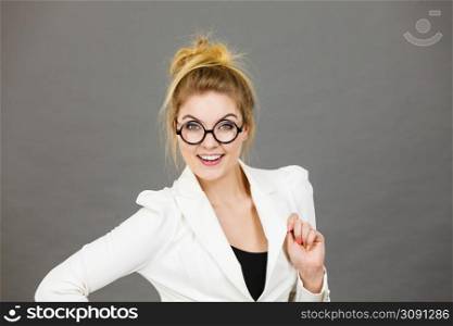 Portrait of happy positive business woman wearing eyeglasses, accountant or teacher, enjoying her work.. Happy positive business woman, accountant or teacher