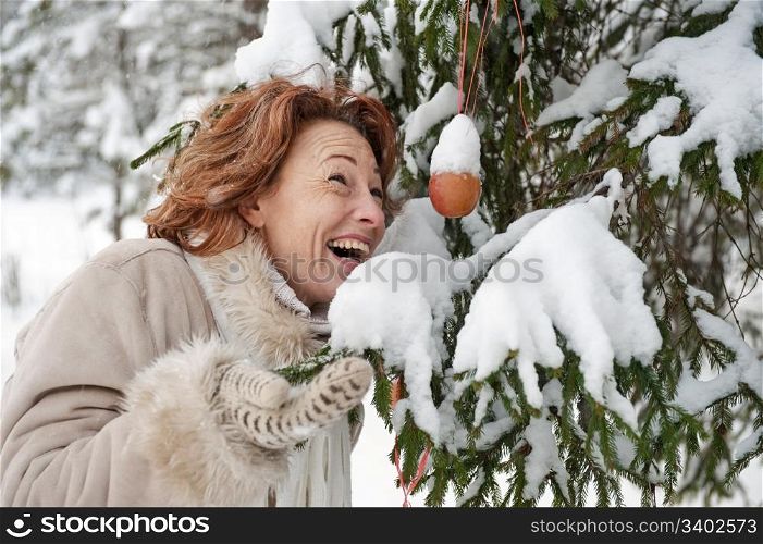 Portrait of happy red-haired woman in winters day.