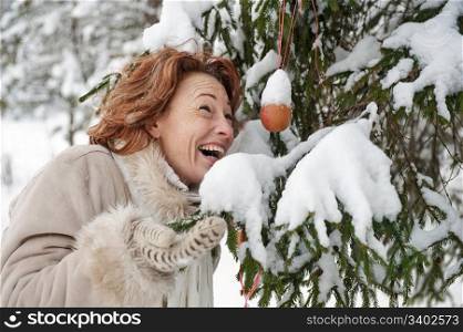 Portrait of happy red-haired woman in winters day.