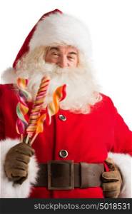 Portrait of happy Santa Claus holding candy looking at camera isolated on white background
