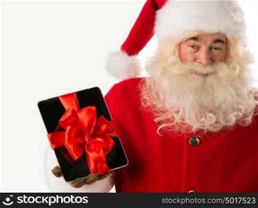 Portrait of happy Santa Claus holding gift Tablet computer in his hands with ribbon and looking at camera