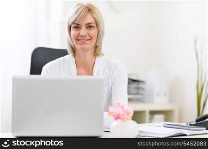 Portrait of happy senior business woman at office