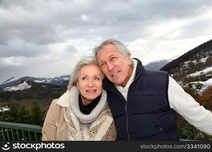 Portrait of happy senior couple at the mountain