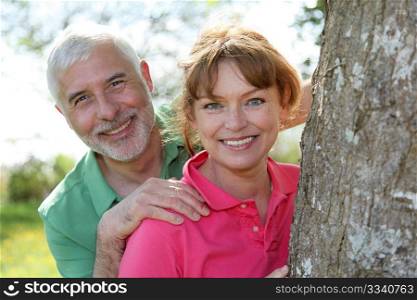 Portrait of happy senior couple in a park