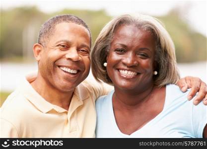 Portrait Of Happy Senior Couple In Garden