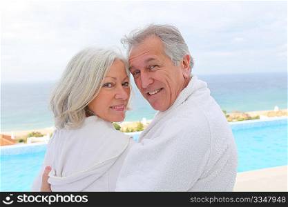 Portrait of happy senior couple in spa center