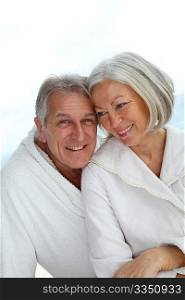 Portrait of happy senior couple in spa center