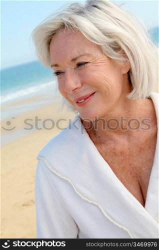 Portrait of happy senior woman in spa resort