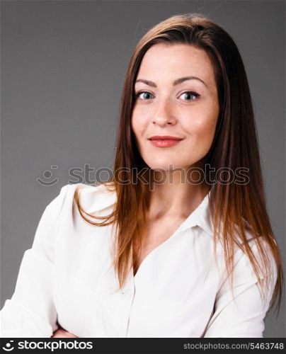 Portrait of happy smiling business woman on gray background. smiling business woman