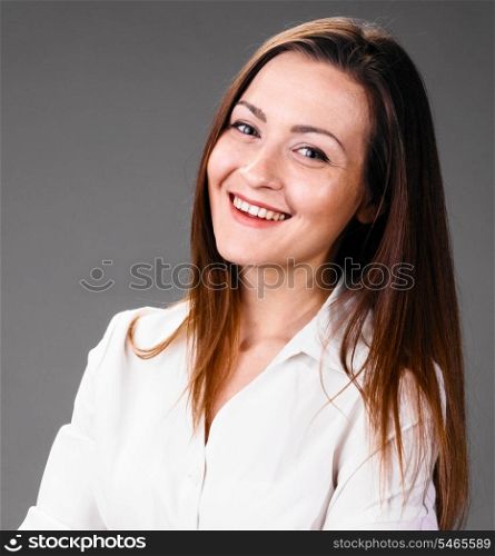 Portrait of happy smiling business woman on gray background. smiling business woman