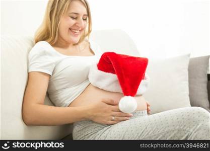 Portrait of happy smiling expectant mom celebrating Christmas