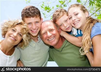 portrait of happy smiling family looking at camera