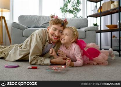 Portrait of happy smiling father and daughter, family playful time at home, daddy funny makeup. Portrait of happy smiling father and daughter