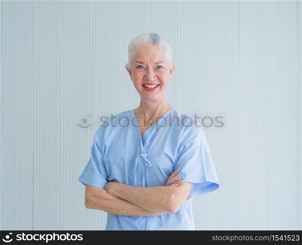 Portrait of happy smiling western sick old female senior elderly patient, woman person in hospital in medical healthcare concept. Caucasian people