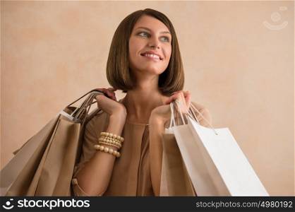 Portrait of happy smiling woman holding shopping bags